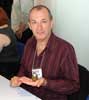 Dave Gibbons holding his 'Rorschach Penguin'